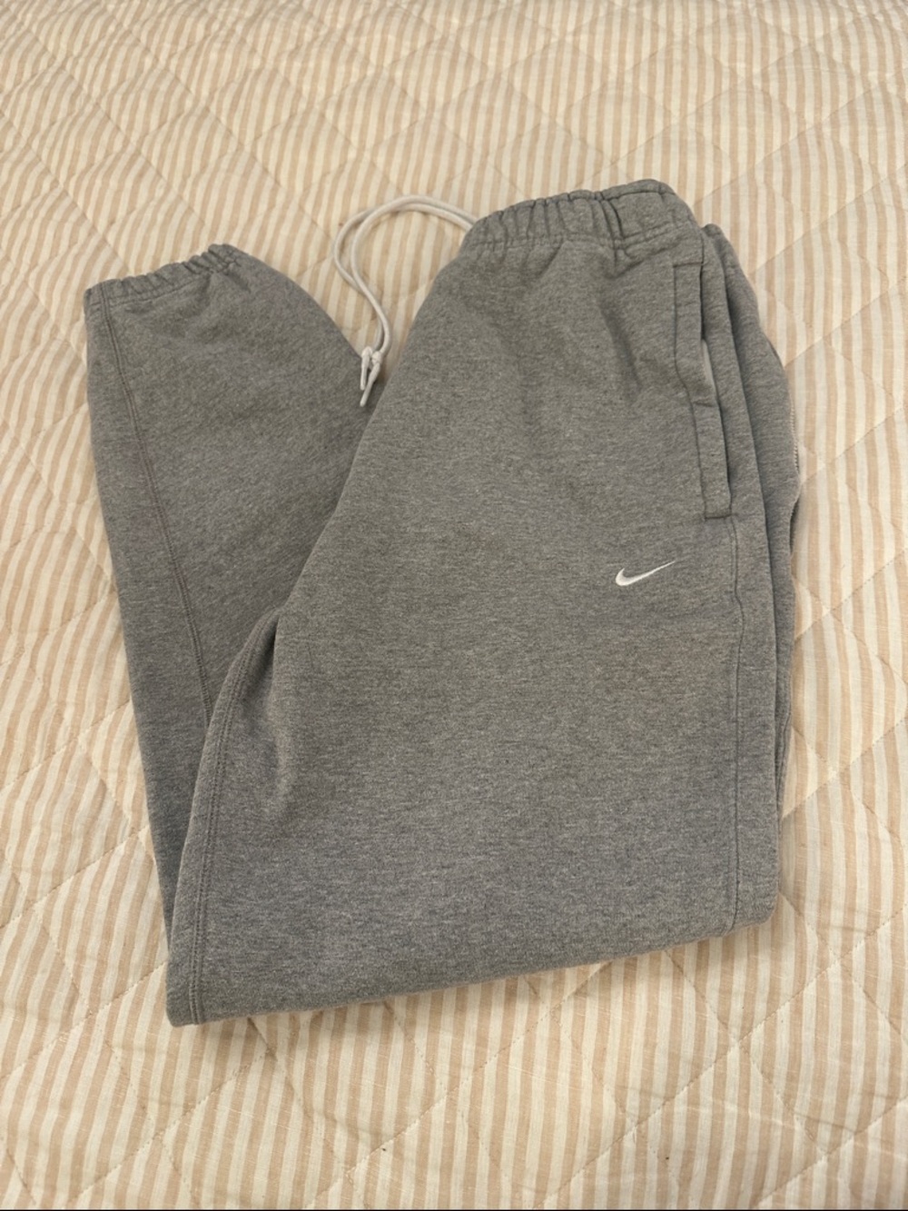 Nike men’s Grey Fleece Joggers with White Swoosh